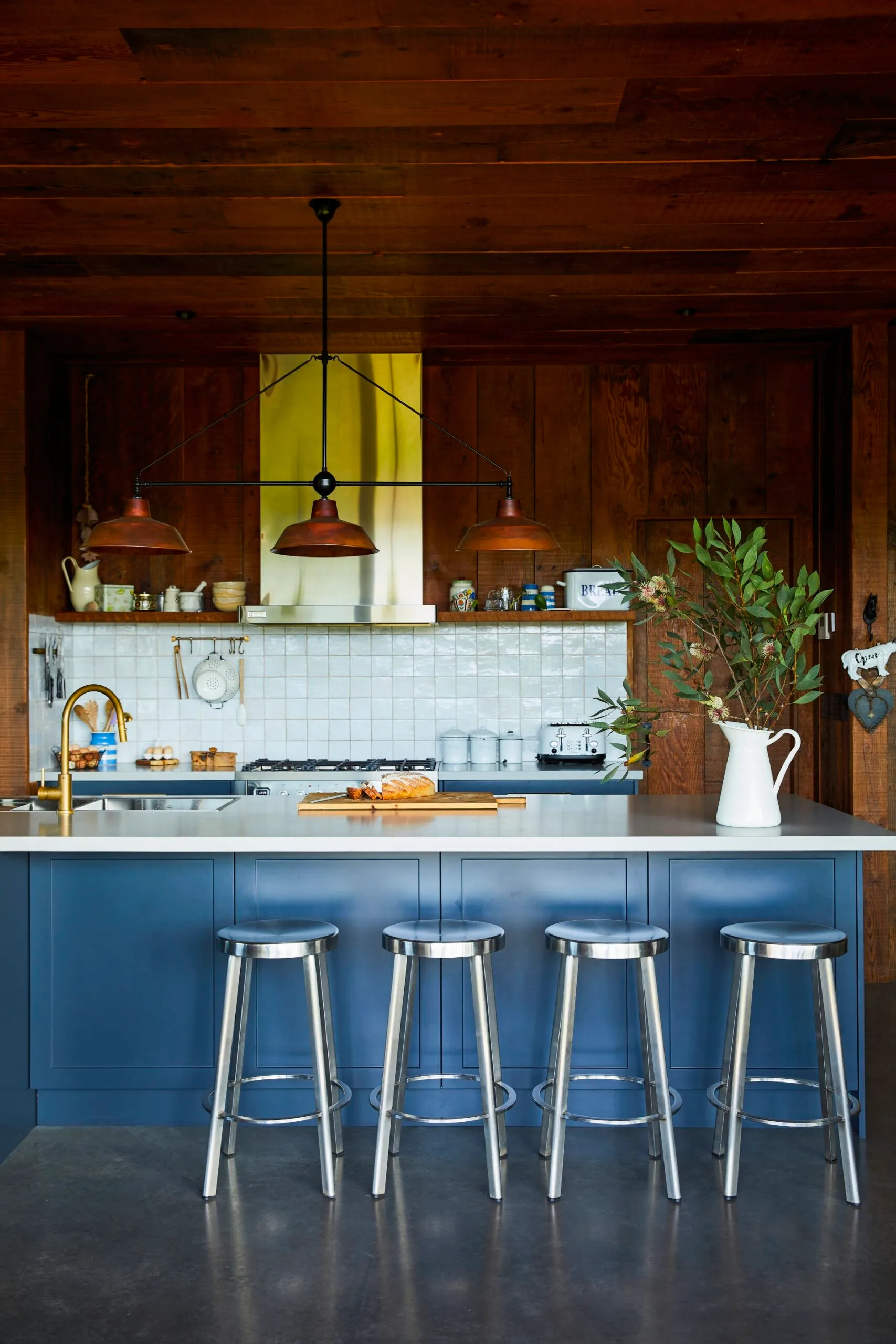Blue and dark timber kitchen. 
