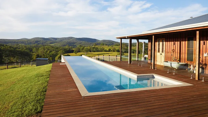 This rural timber farmhouse comes with a romantic outdoor tub