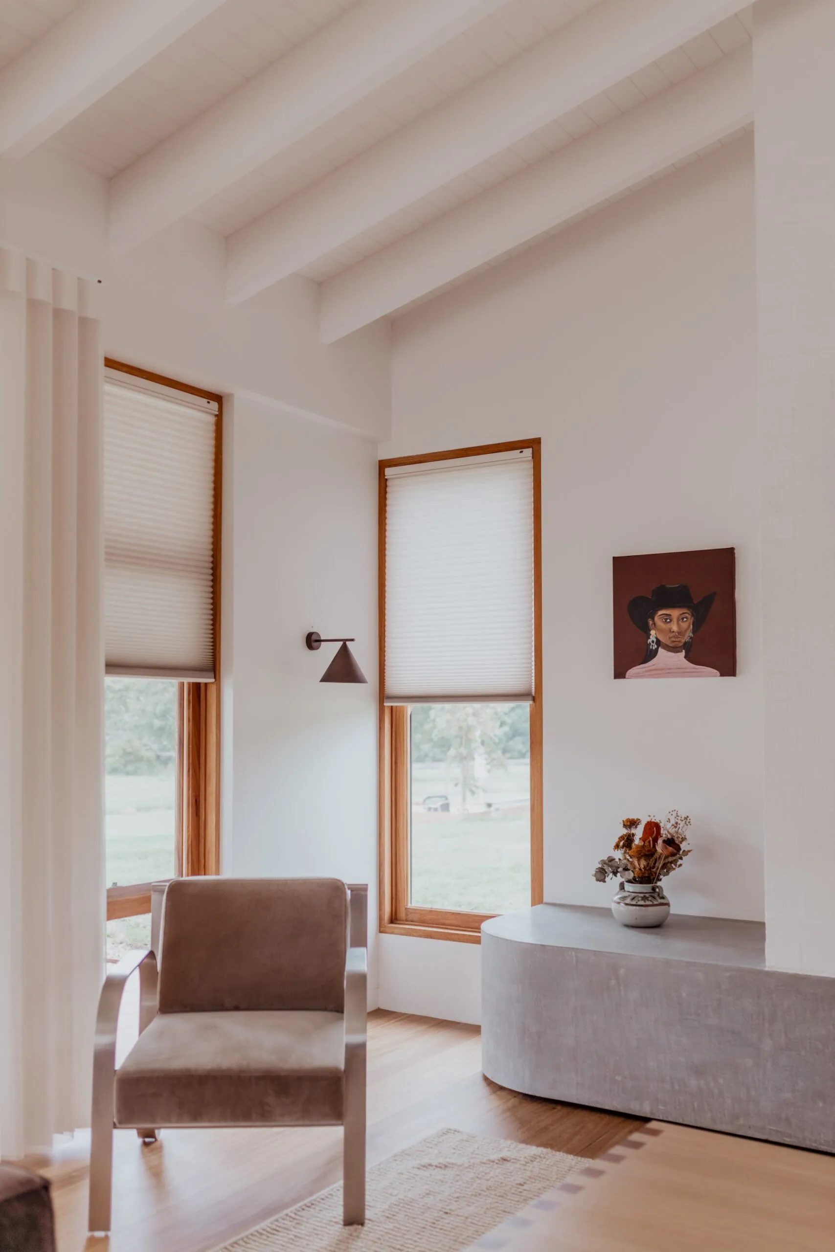 Luxaflex roller blinds on a window keep the room warm in winter and cool in summer. 