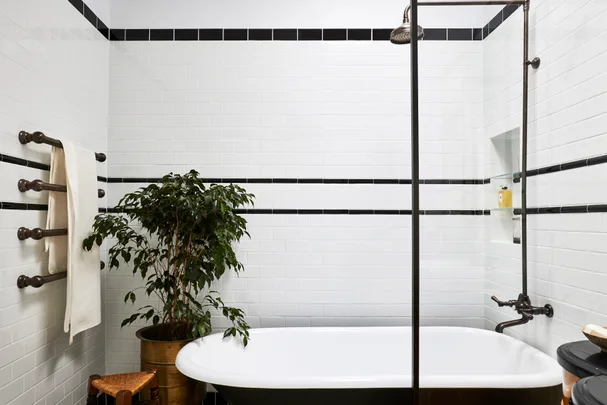 A claw foot bath in a 1920s inspired art deco bathroom.