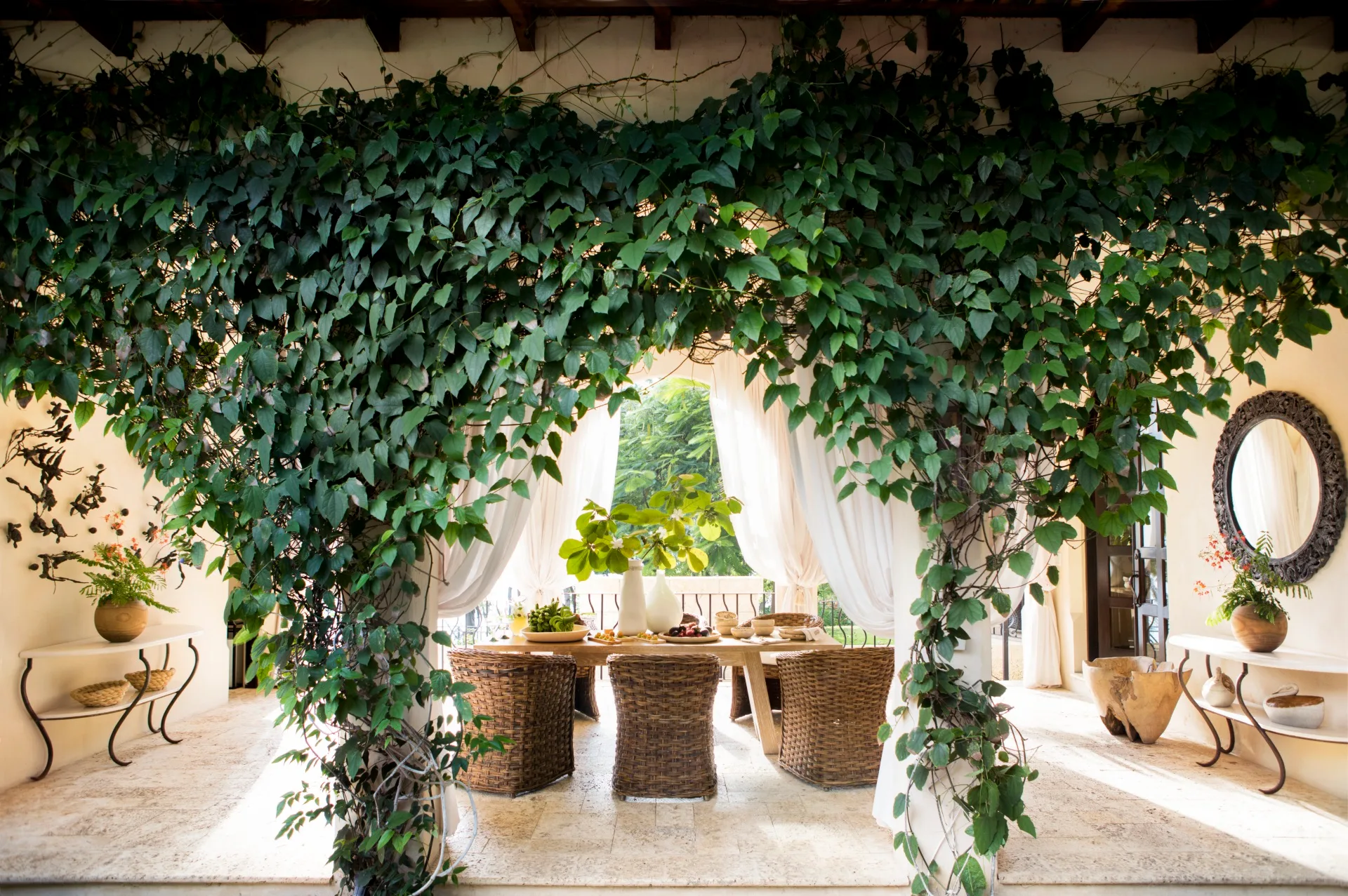 An opne-air dining area in Costa Rica under the vines. 