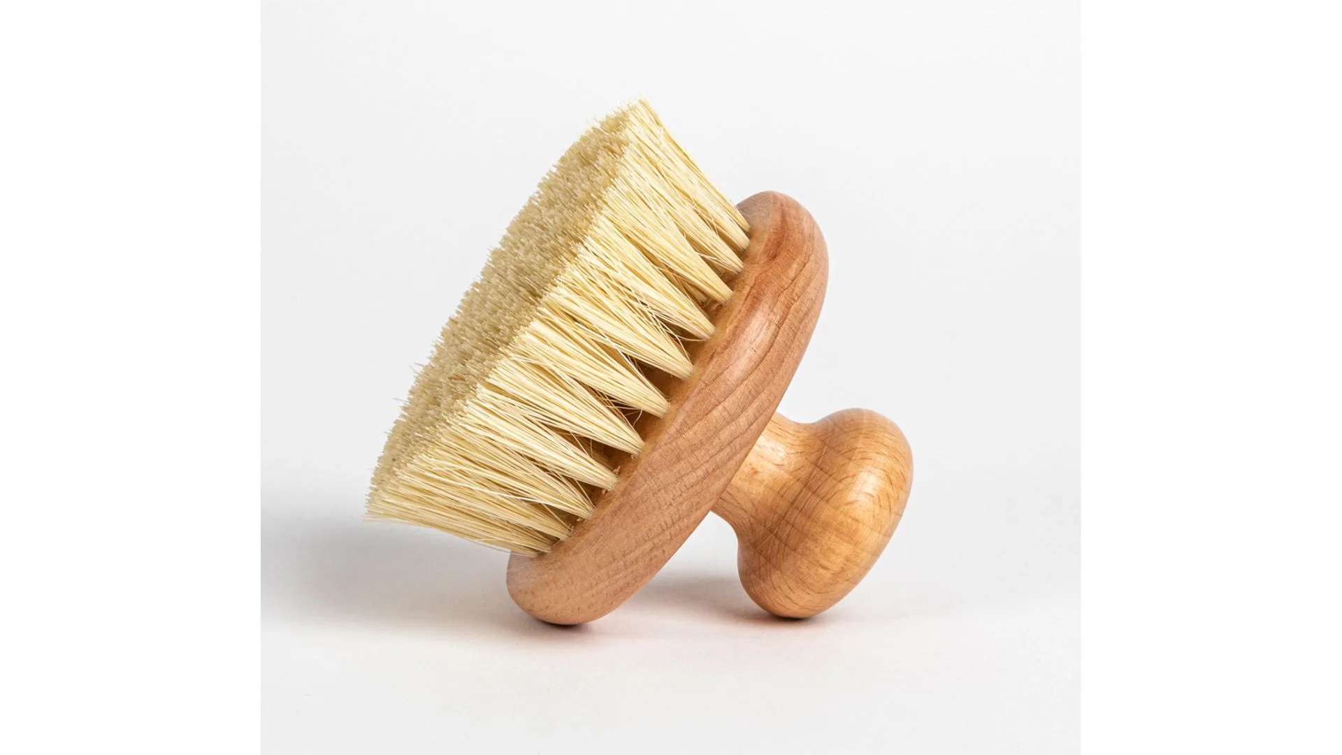 A body brush with wooden handle
