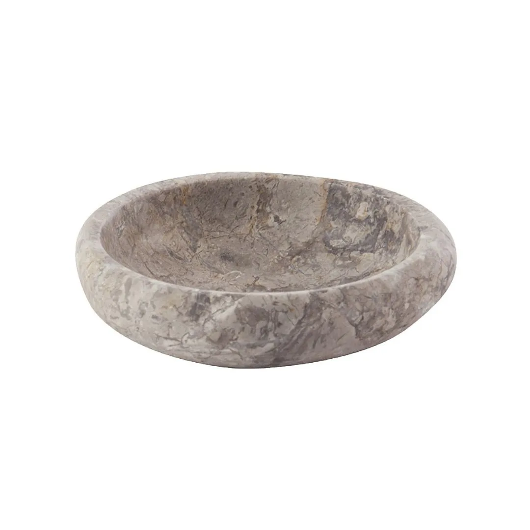 A dark grey circular soap dish. 