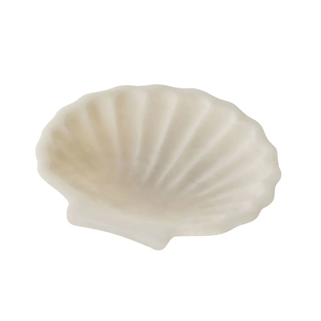 A shell shaped soap dish. 