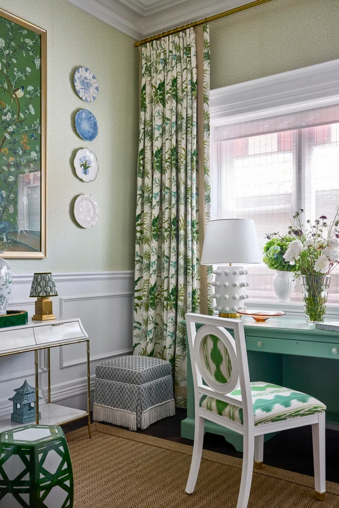 A study with a green desk and green patterned curtains inside a heritage home in the Inner West.