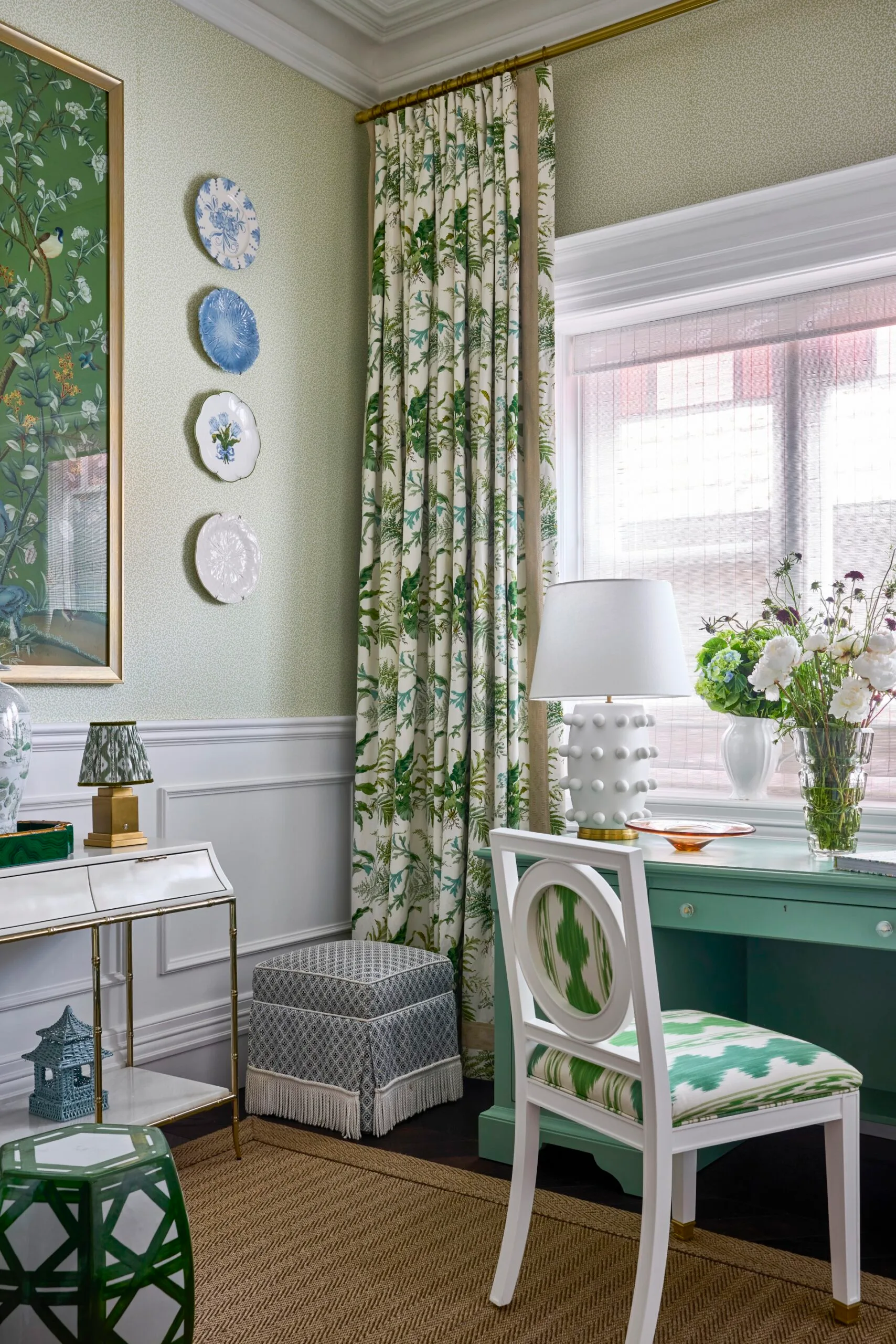 A study with a green desk and green patterned curtains inside a heritage home in the Inner West. 