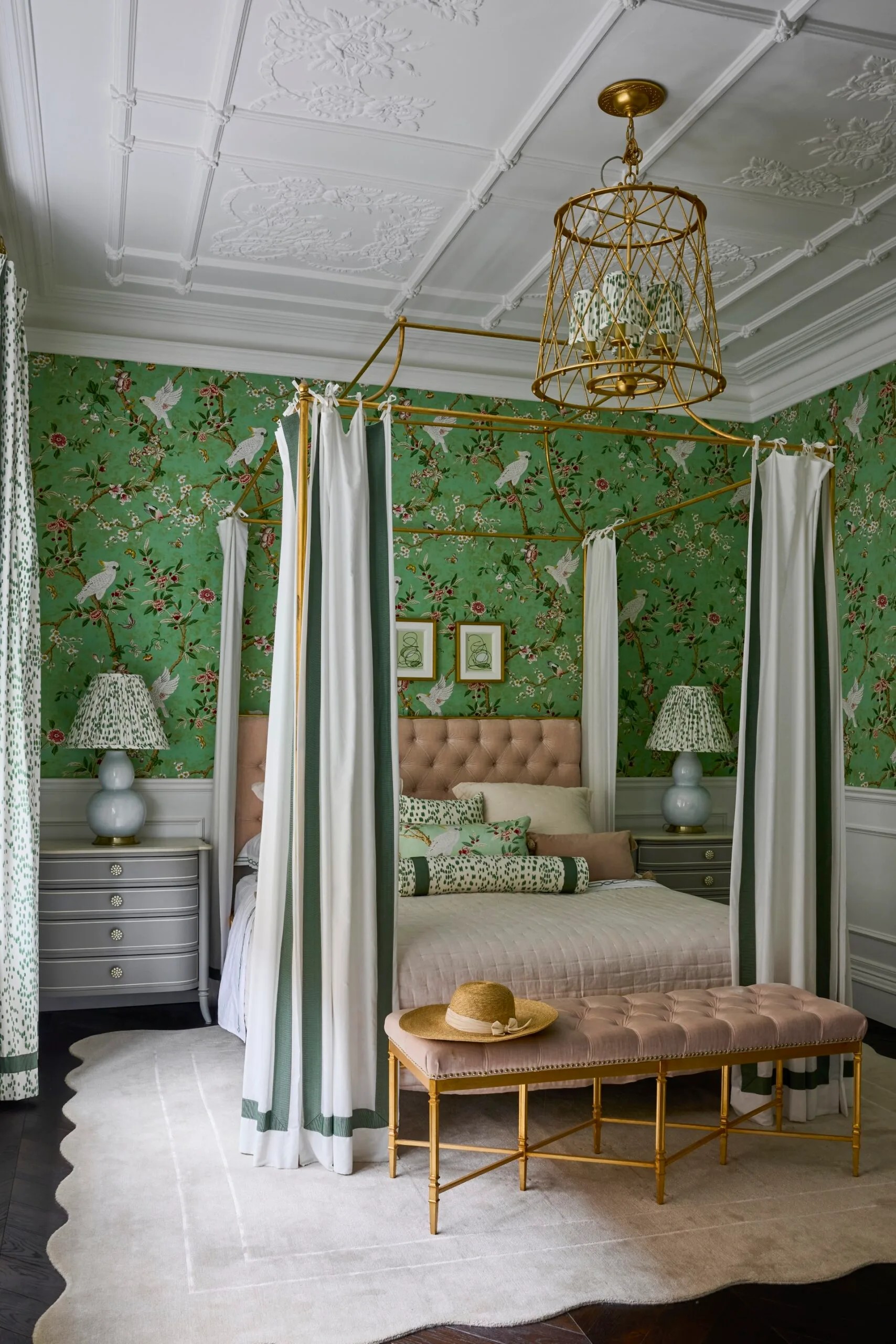 Green patterned wallpaper and a four poster bed inside the bedroom of a Sydney heritage home. 