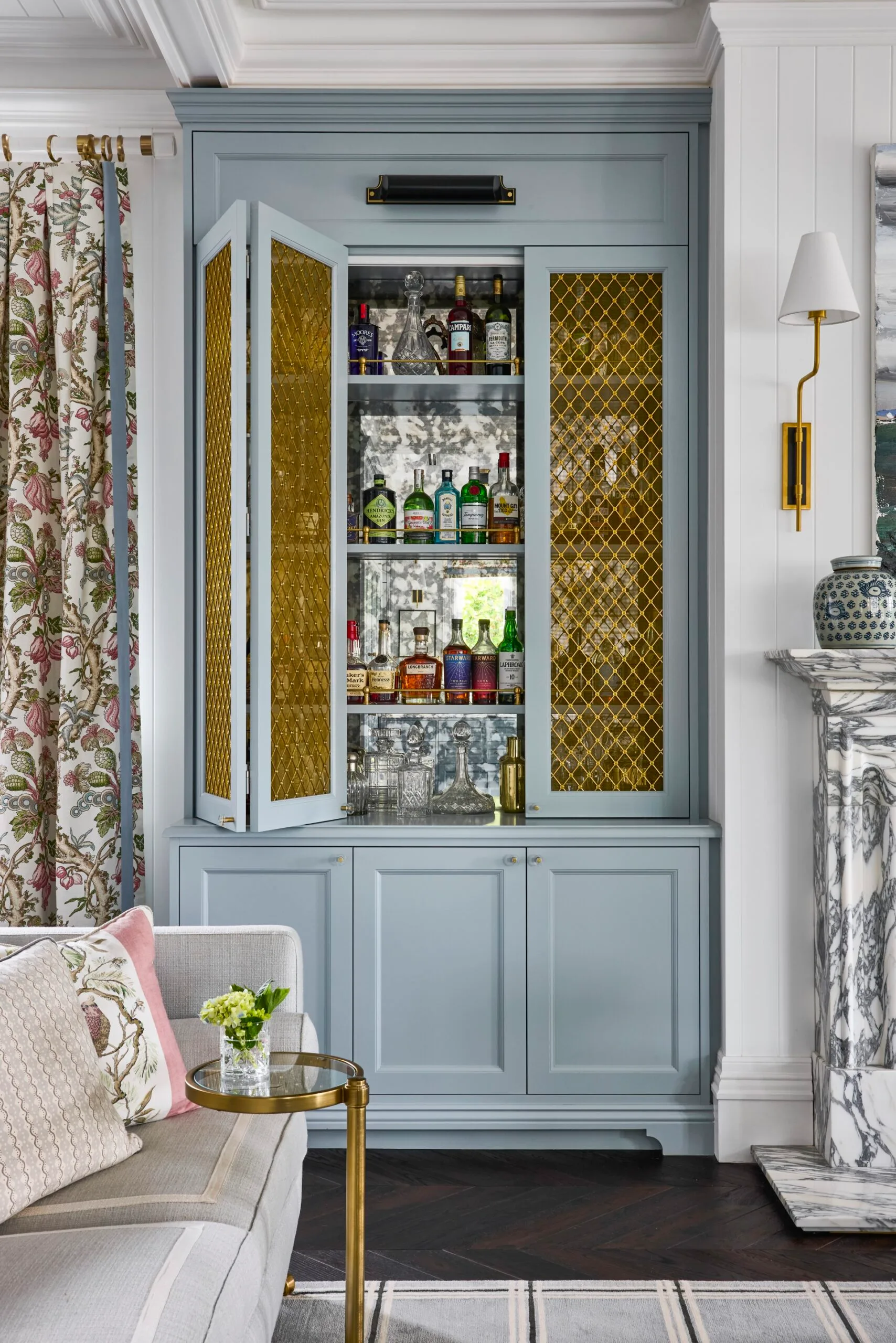 The baby blue bar cupboard inside the living room of an Inner West heritage home. 