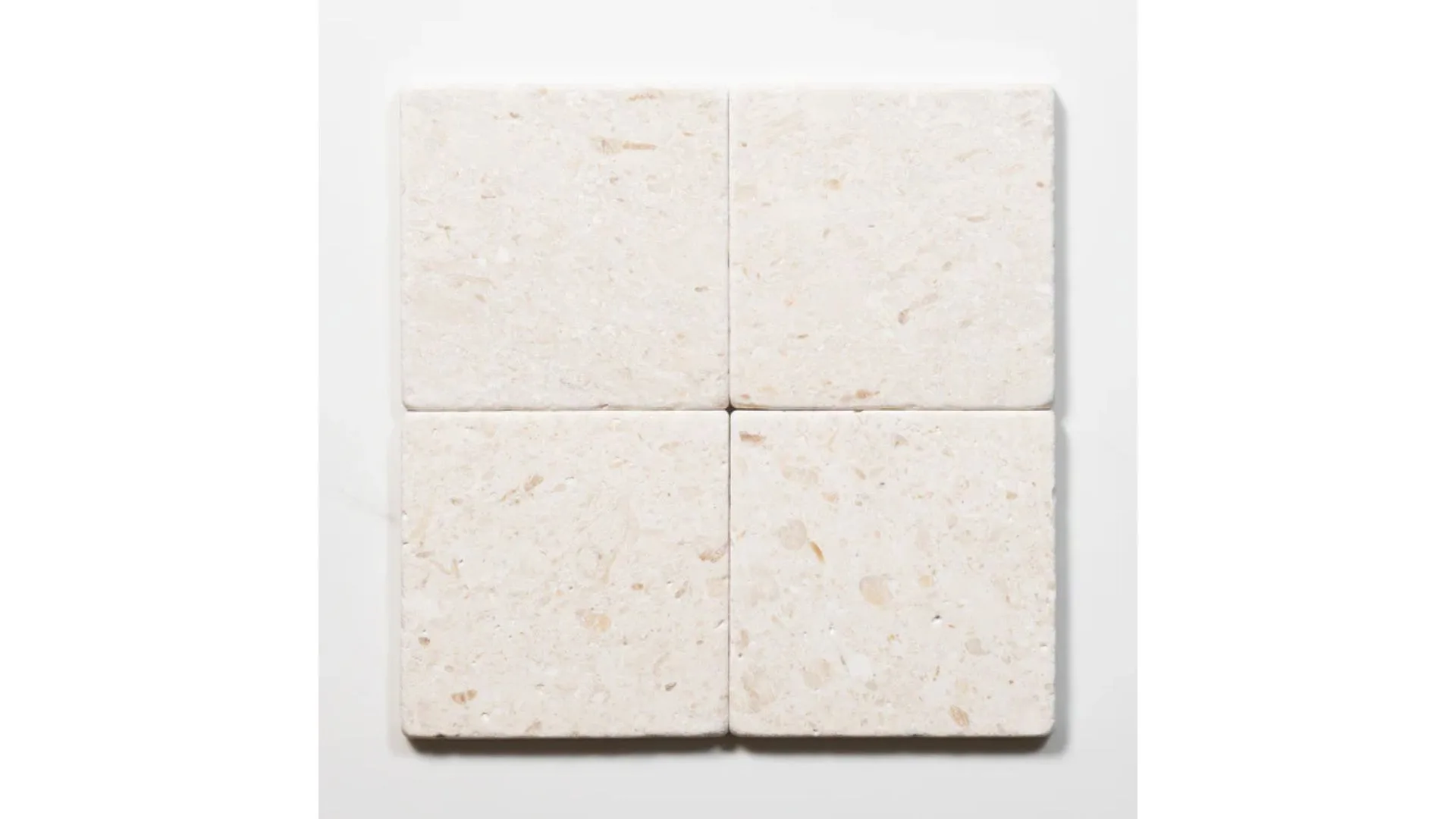 Tumbled white natural limestone square tiles in earth tones