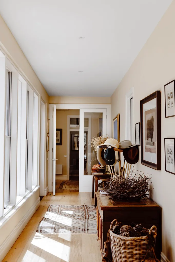 A hallway lined with art.