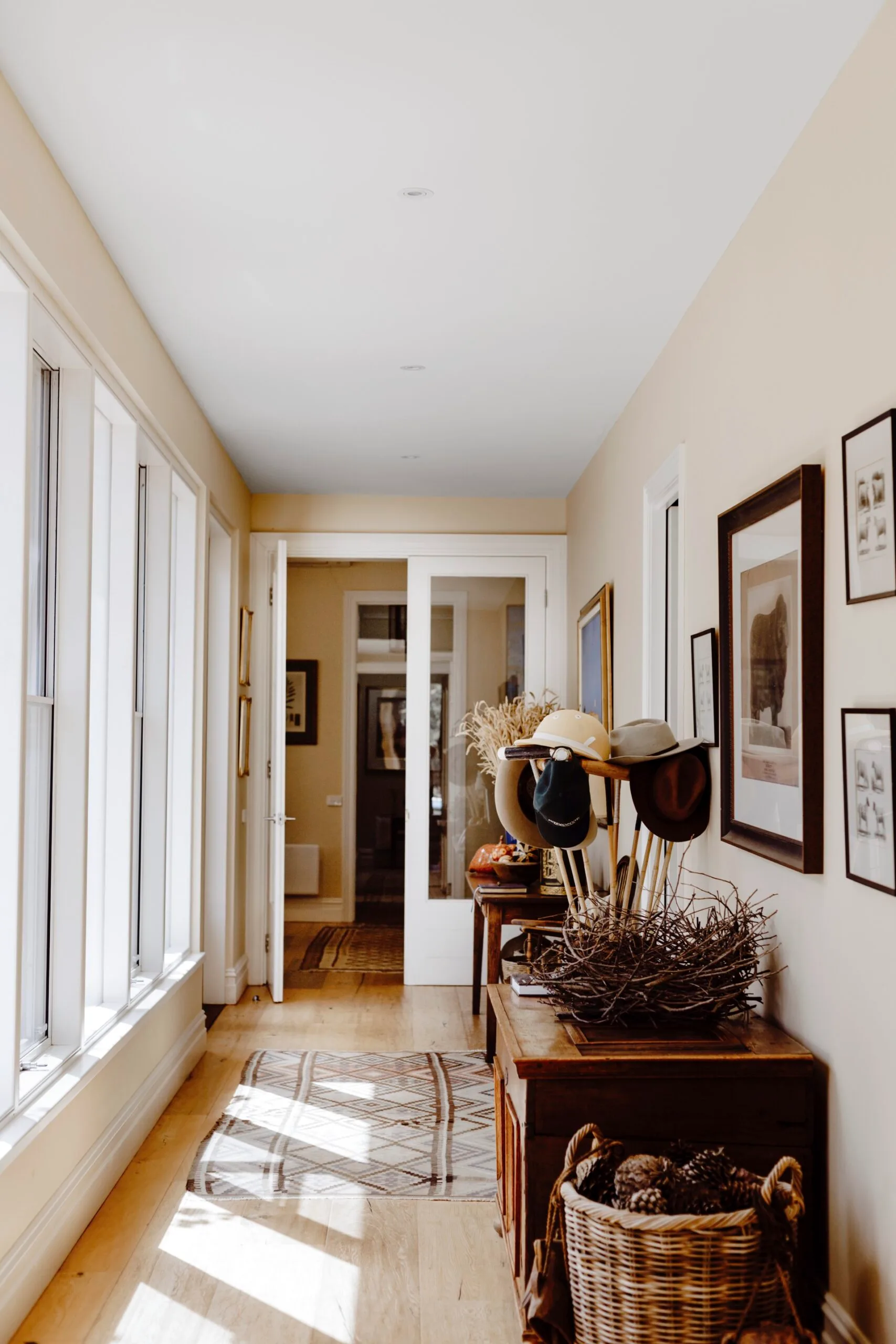 A hallway lined with art. 