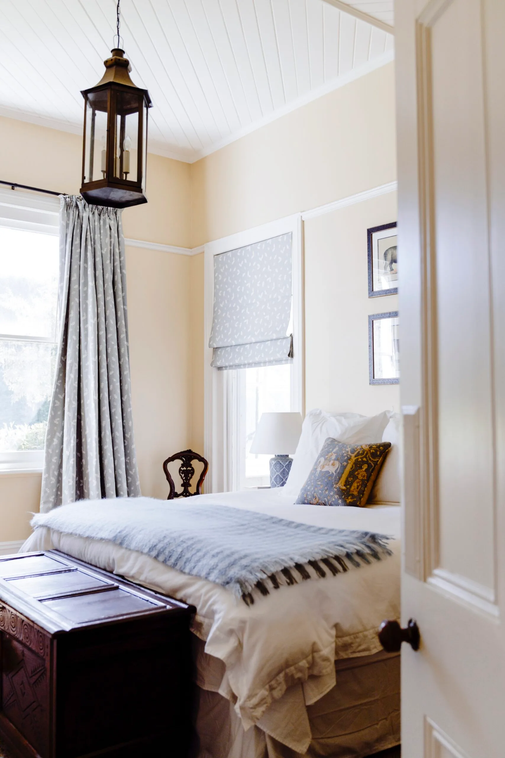 The main bedroom is
a restful study of neutral tones and duck egg blue.