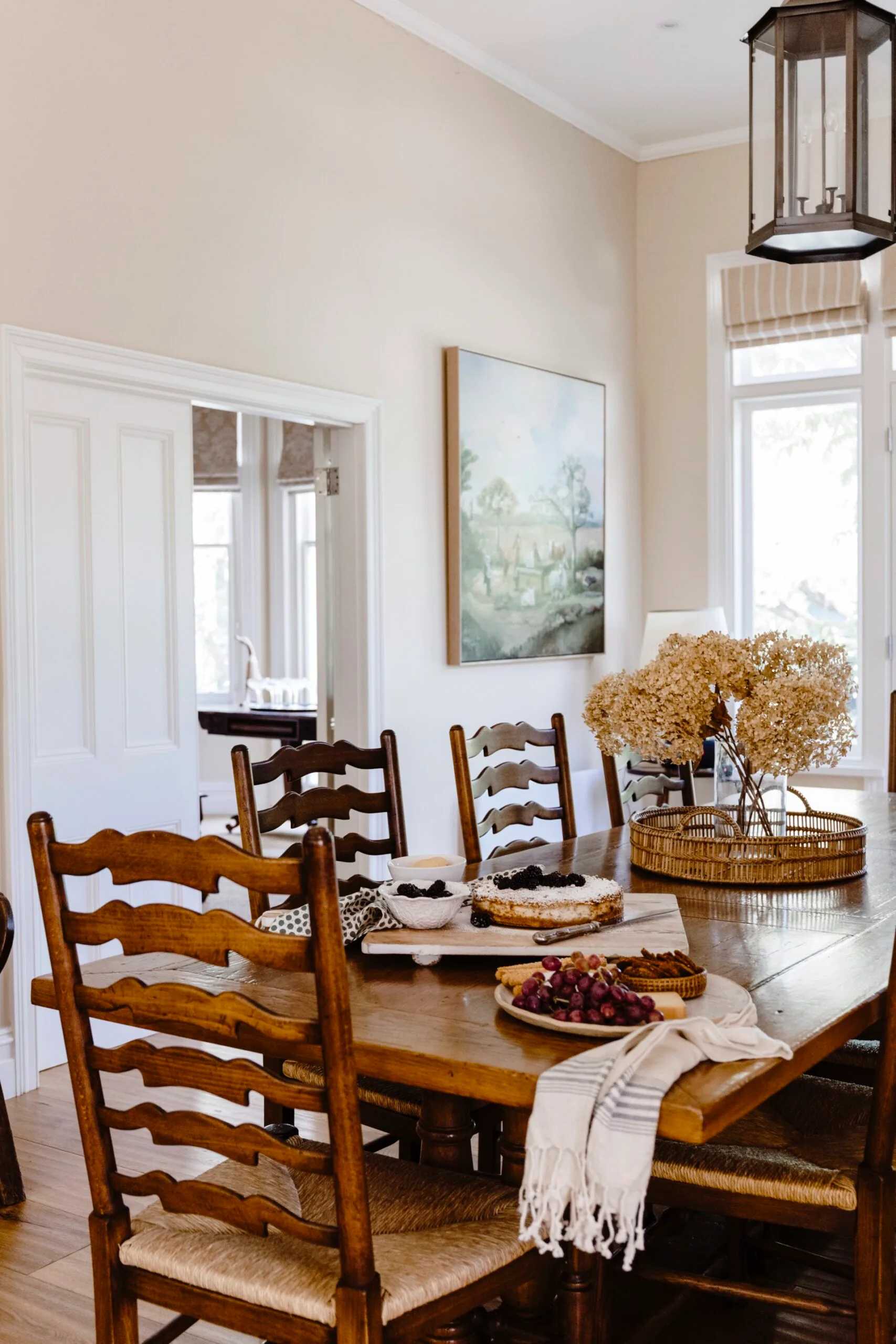 A dining table with ladderback chairs. 