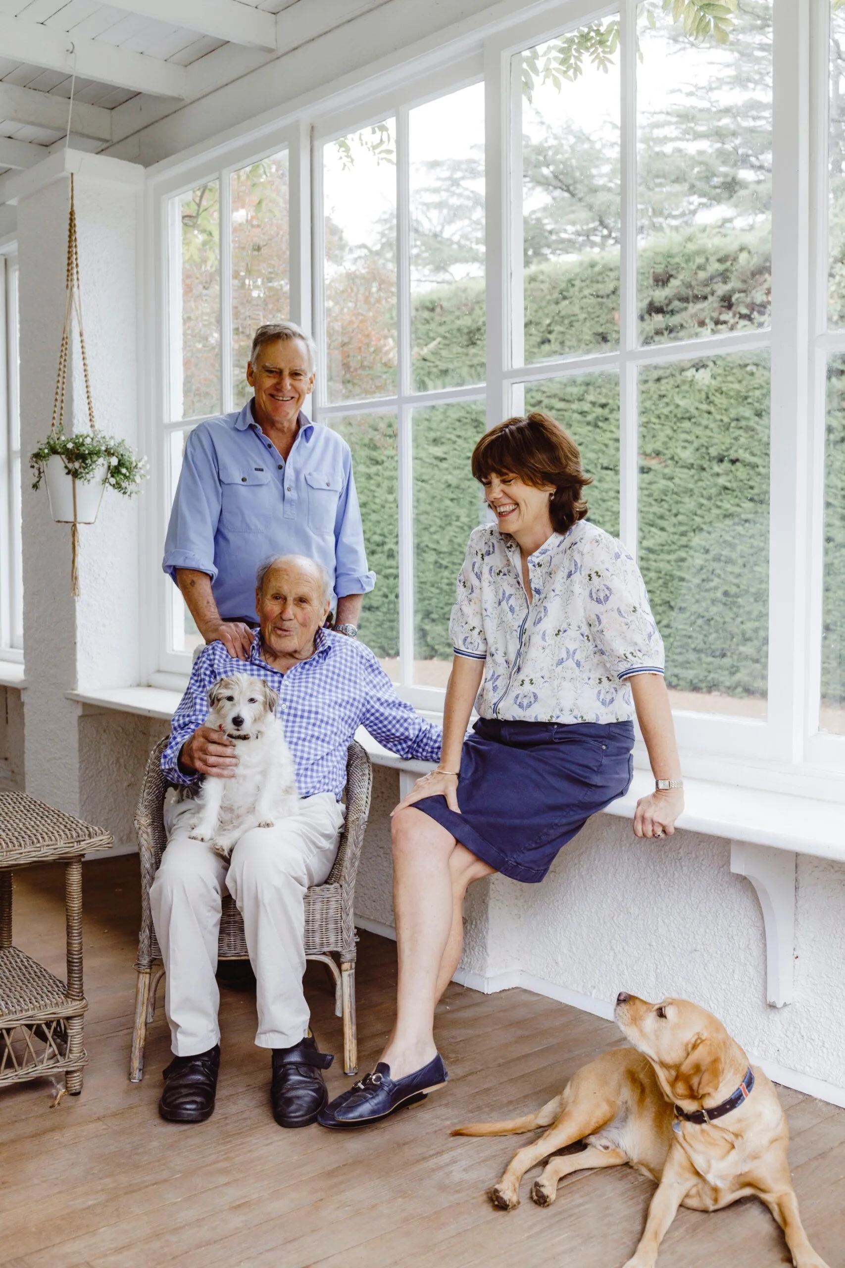 The owner of a historical homestead pictured with his dad, sister and dog. 