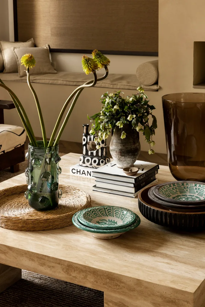 A collection of decorative items on a living room coffee table.