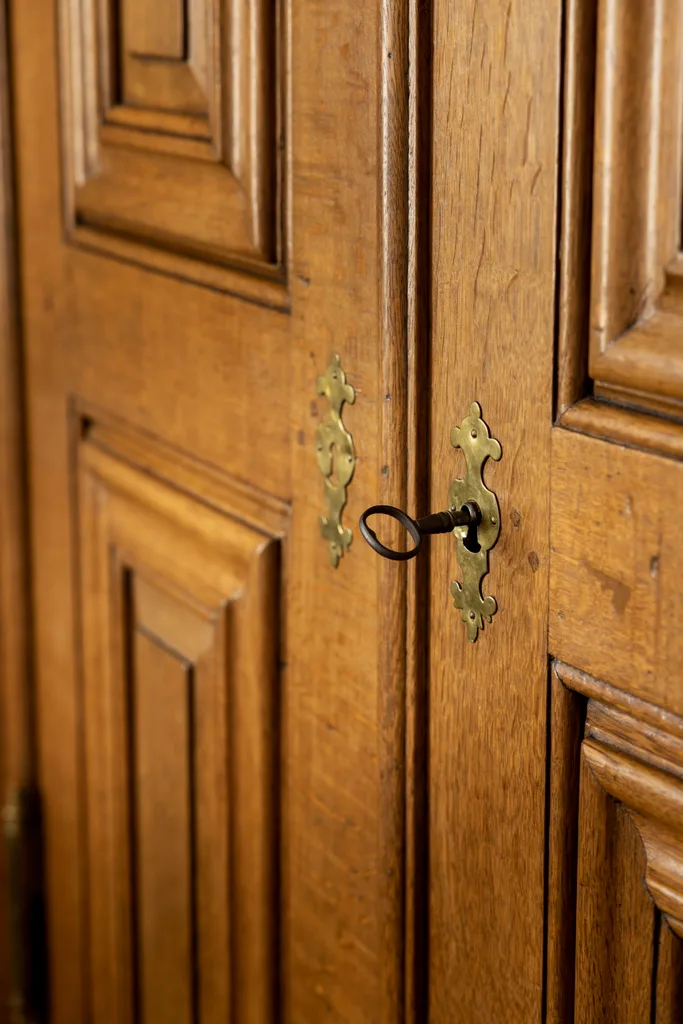 A heritage wooden door with an antique key.