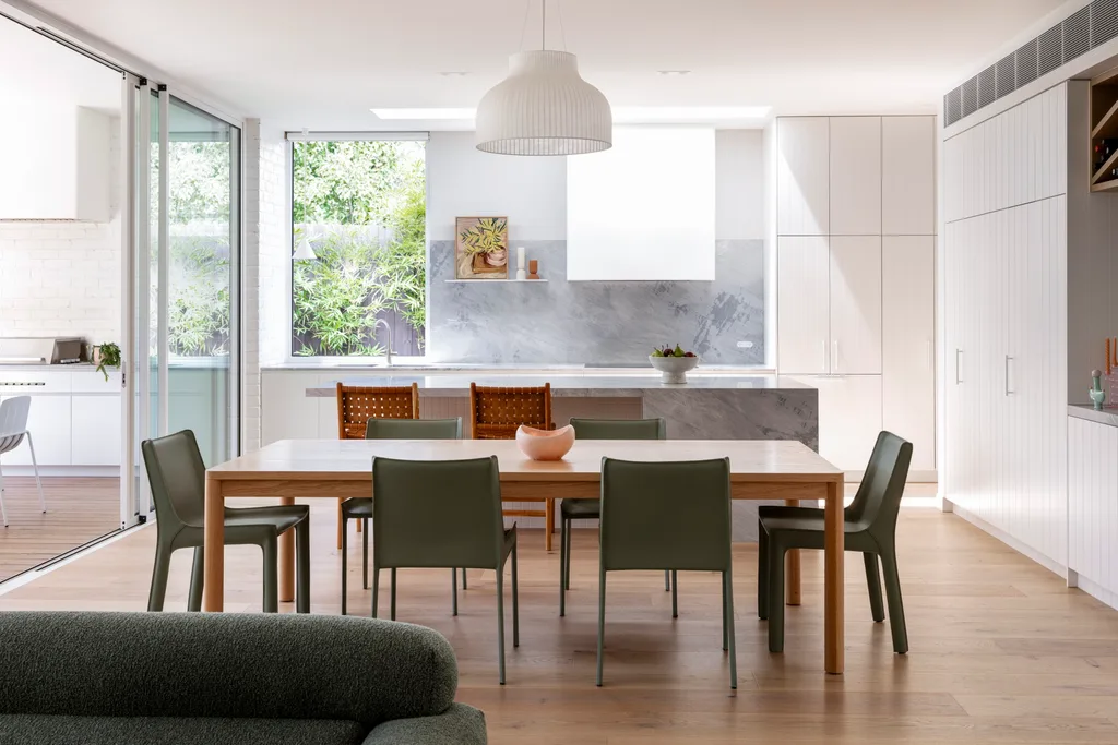 The light-filled dining area inside a renovated bungalow.