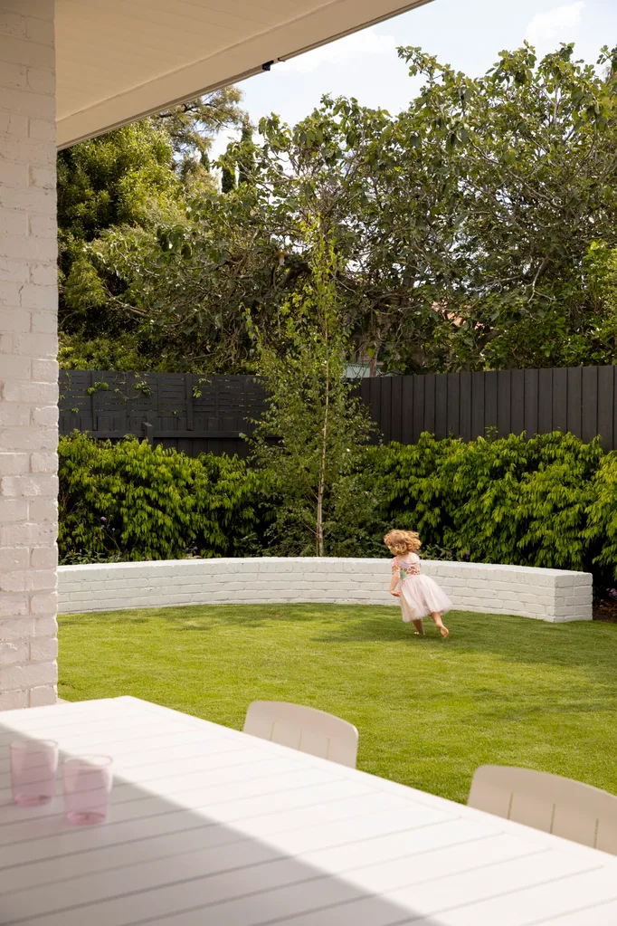 A small area of lawn belonging to a recently renovated bungalow.