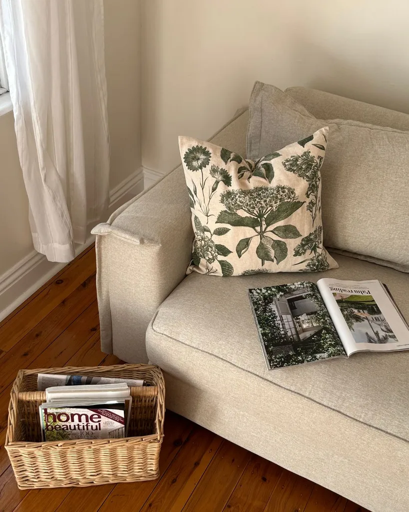 The Ecosa Sydney Sofa Bed styled with a green cushion.