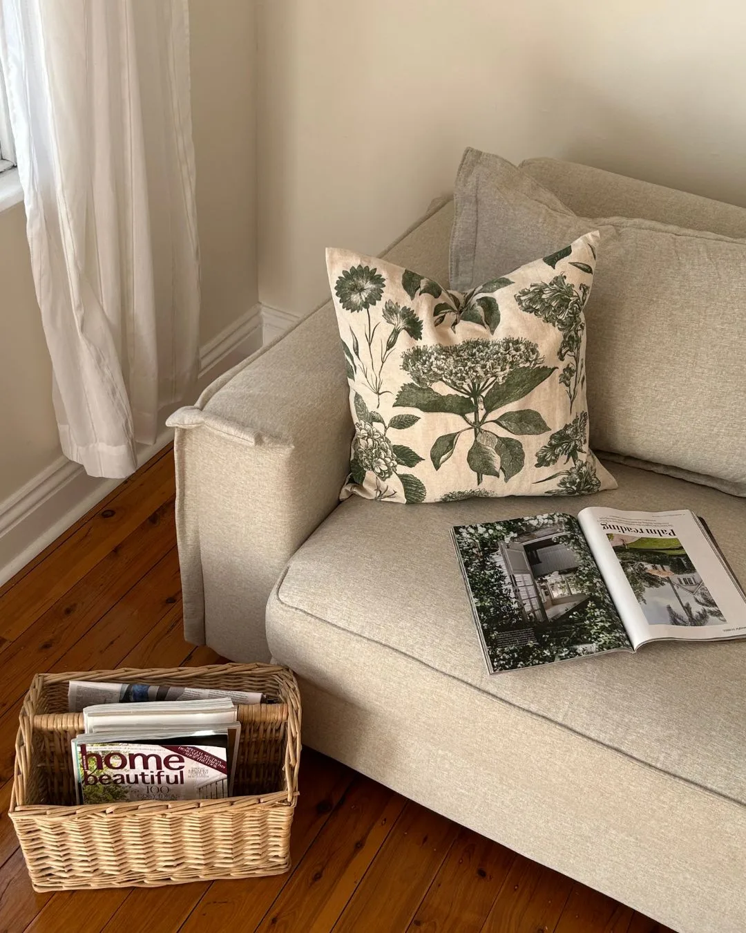 The Ecosa Sydney Sofa Bed styled with a green cushion.