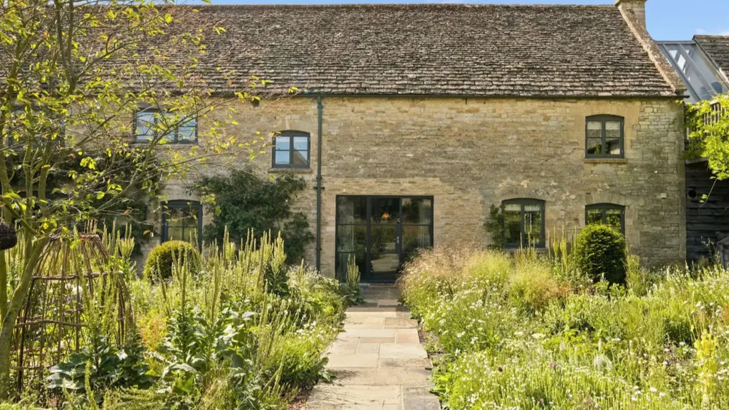 The stone exterior of Ellen Degeneres and Portia De Rossi's Cotswold's home.