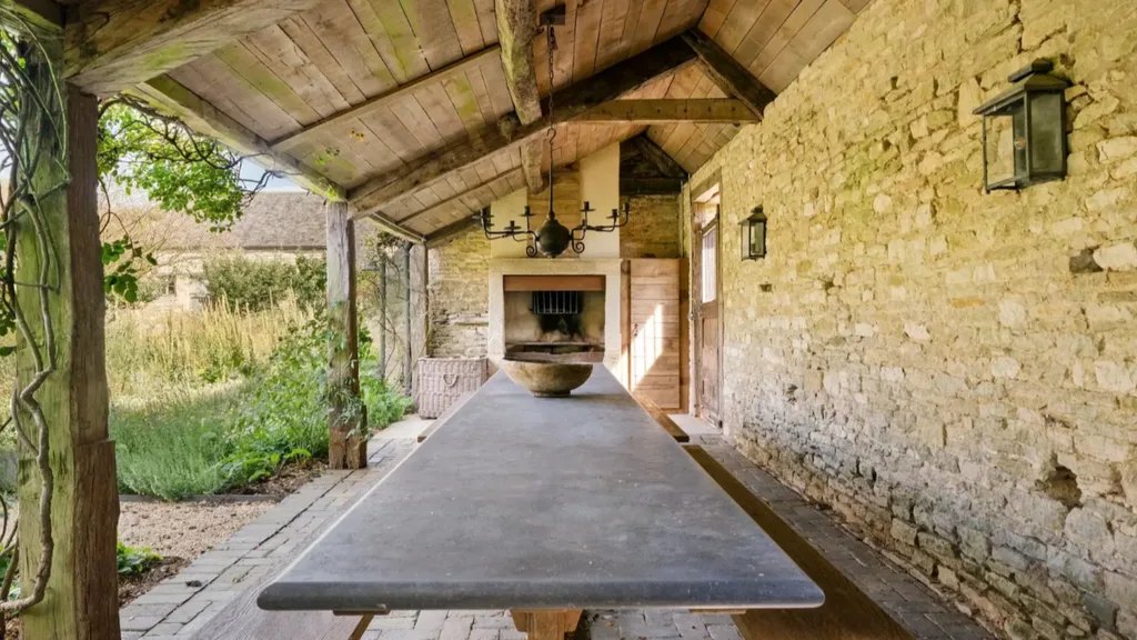 An outdoor dining area at Ellen Degeneres' farmhouse in the Cotswolds.