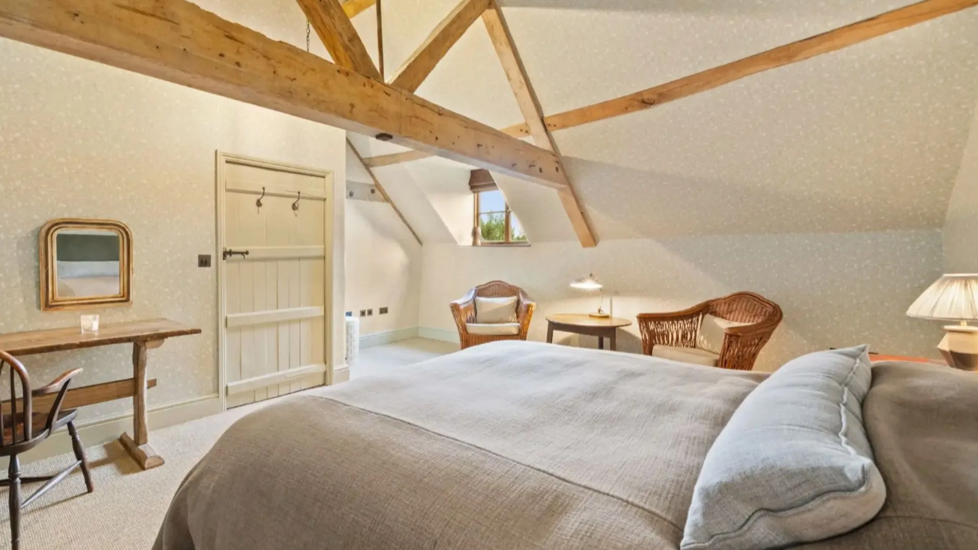 A country style bedroom inside Ellen Degeneres Cotsworld's home. 
