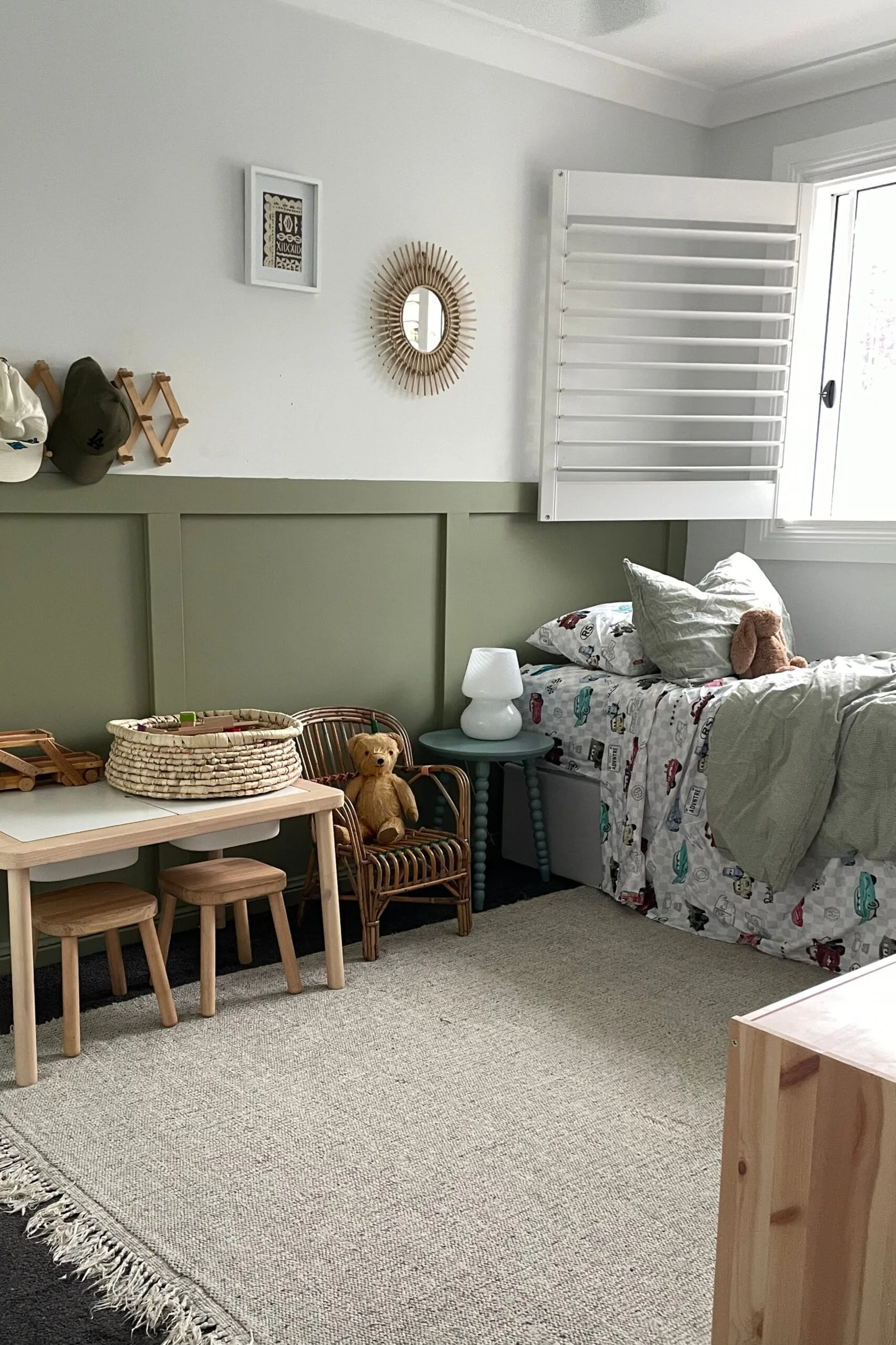 kids bedroom with painted olive green wainscoting