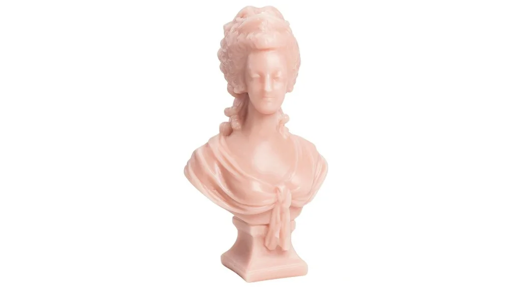 A pink bust of Marie Antoinette that is also a candle from Trudon.