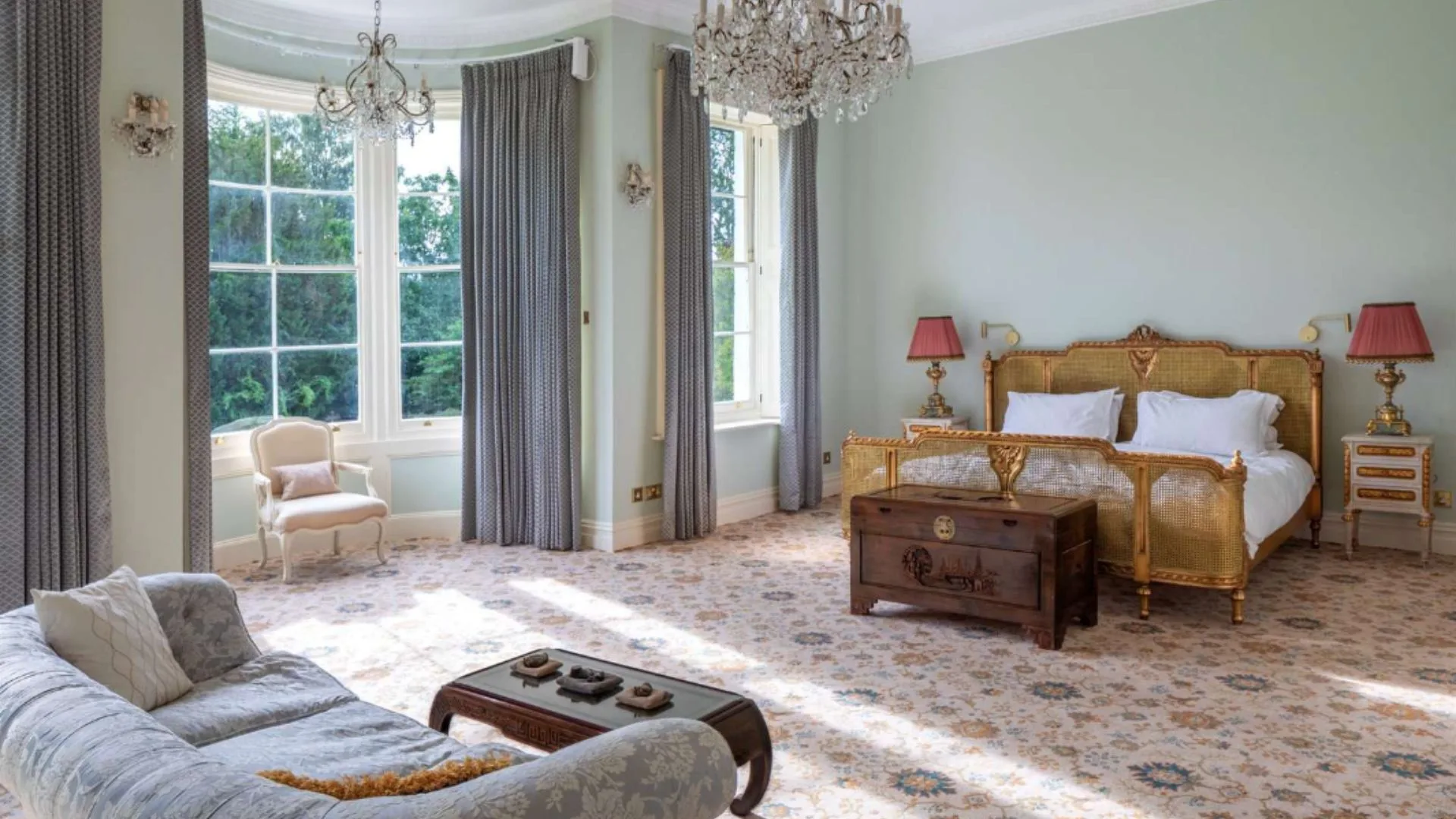 Mel B's bedroom with a floral carpet and bay windows. 
