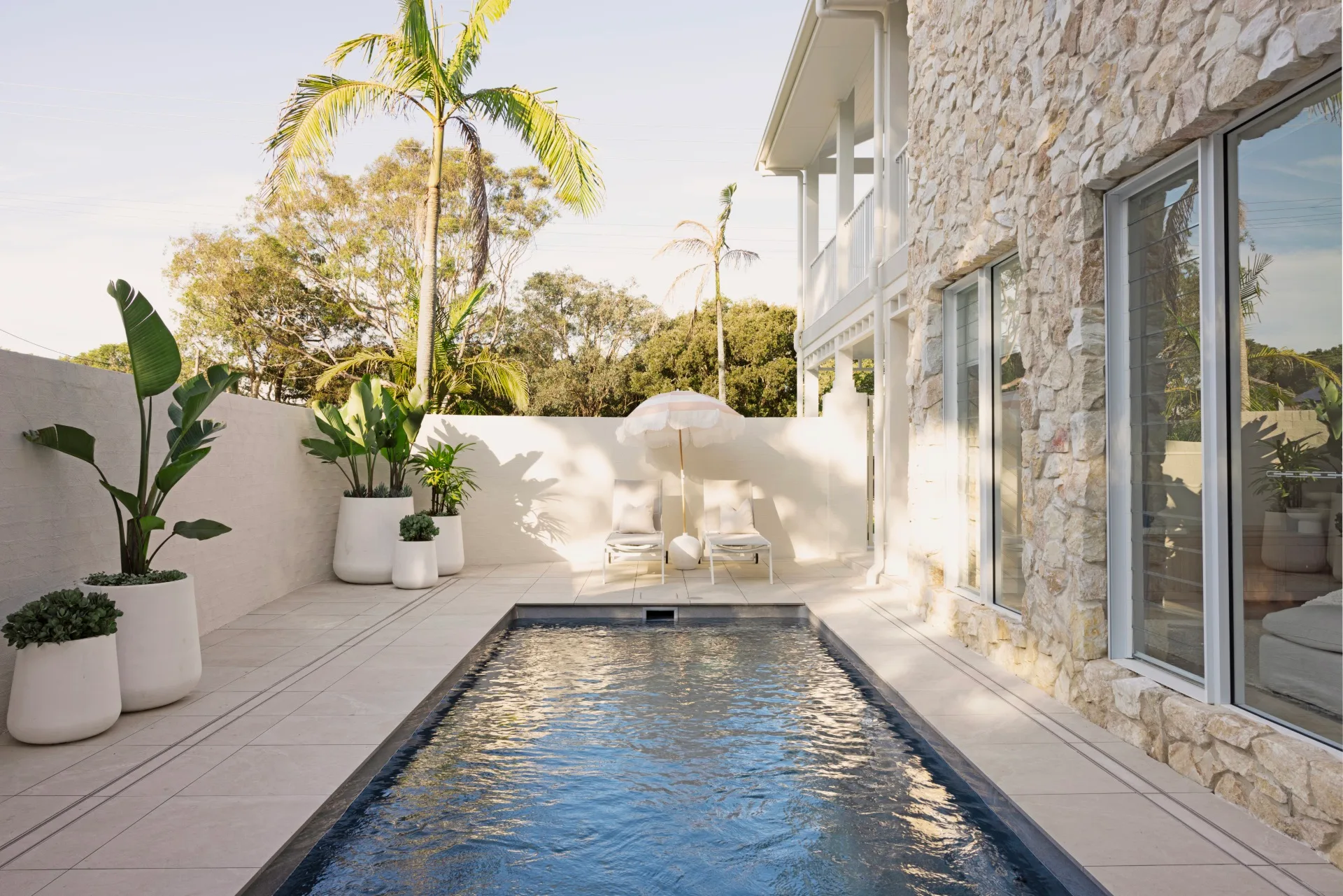 A swimming pool in the backyard of a new build built by Oak and Orange. 