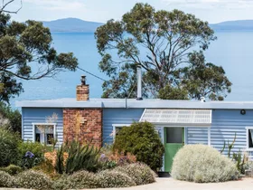 Colourful interiors and striking sea views envelop this Tasmanian Airbnb