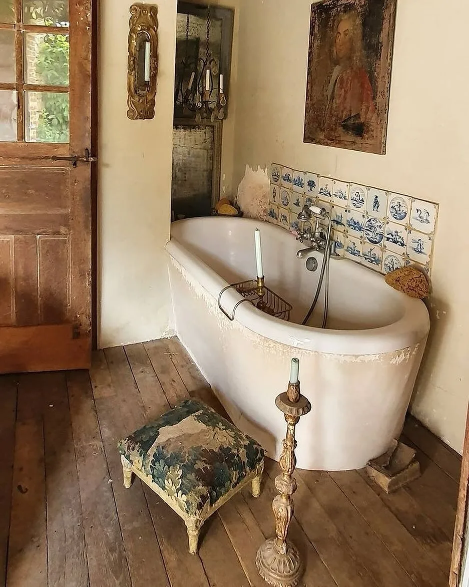 Antique Delft tiles line a bathroom wall.