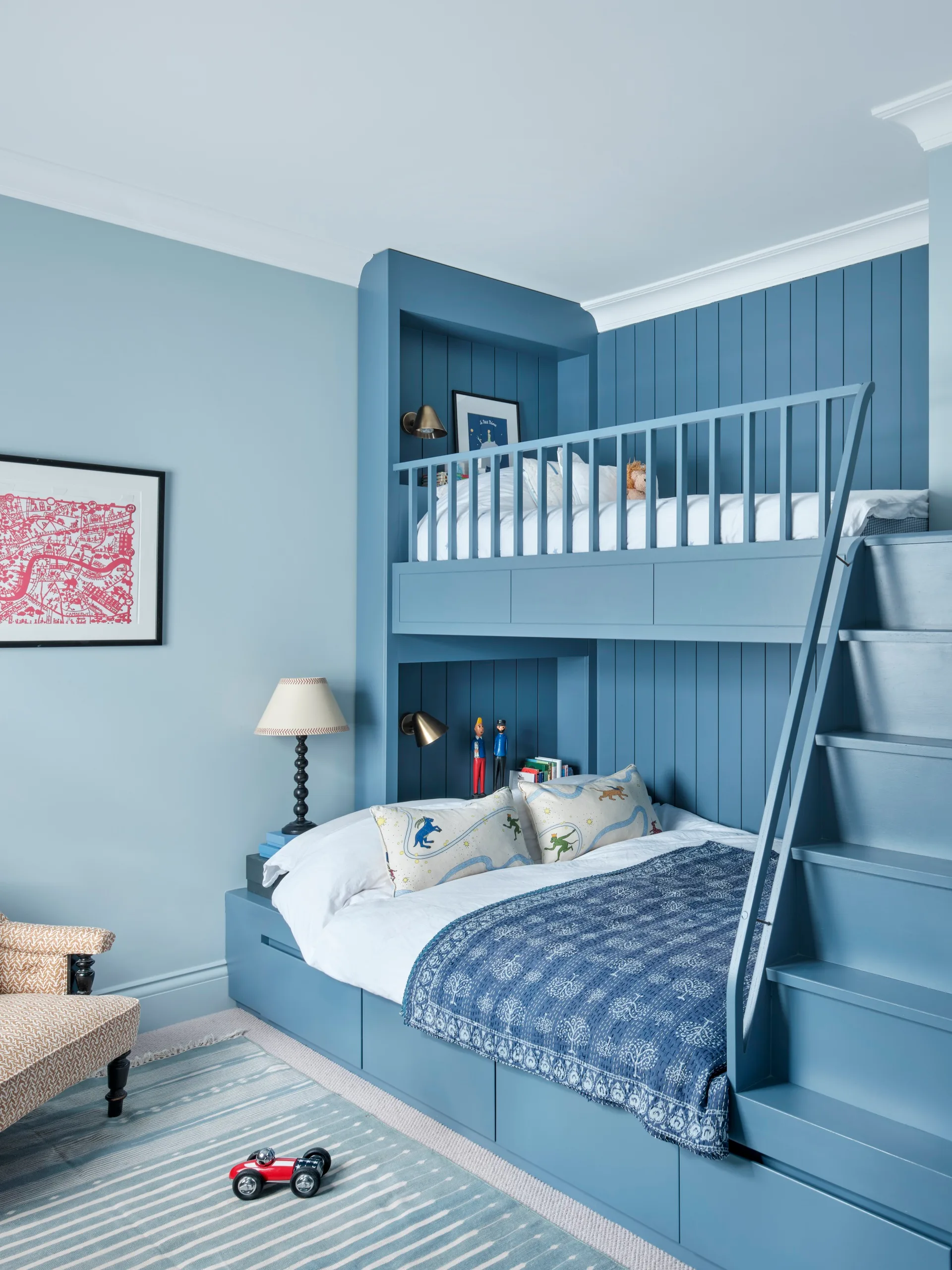 Blue built in bunks in a child's bedroom. 