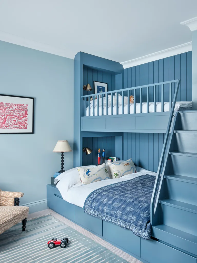 Blue built in bunks in a child's bedroom.