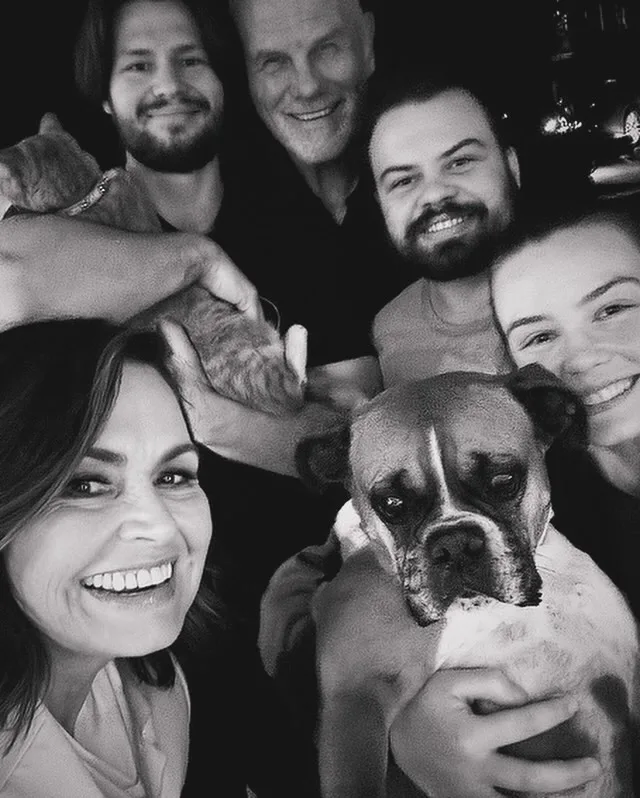 Lisa Wilkinson and Peter FitzSimons with their grown up kids and dog 