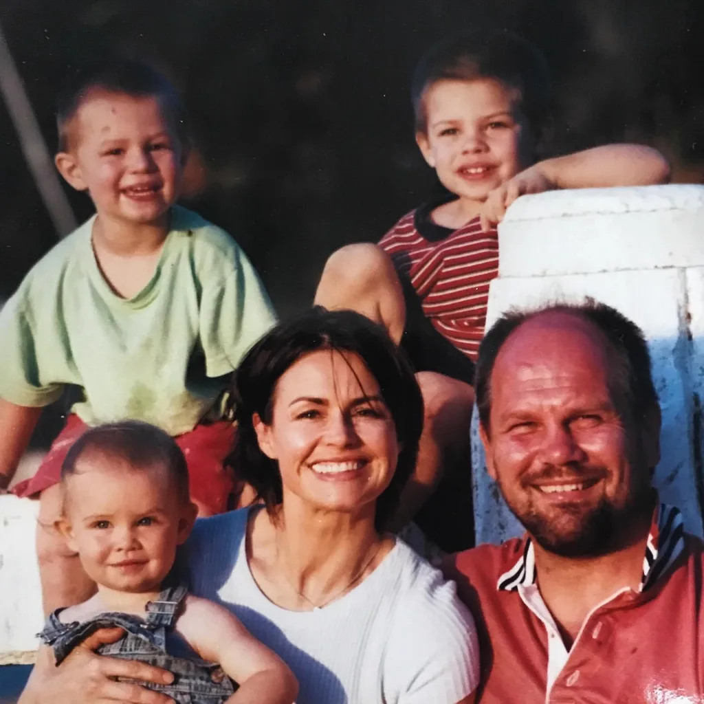 Lisa Wilkinson and Peter FitzSimons with their kids when they were young