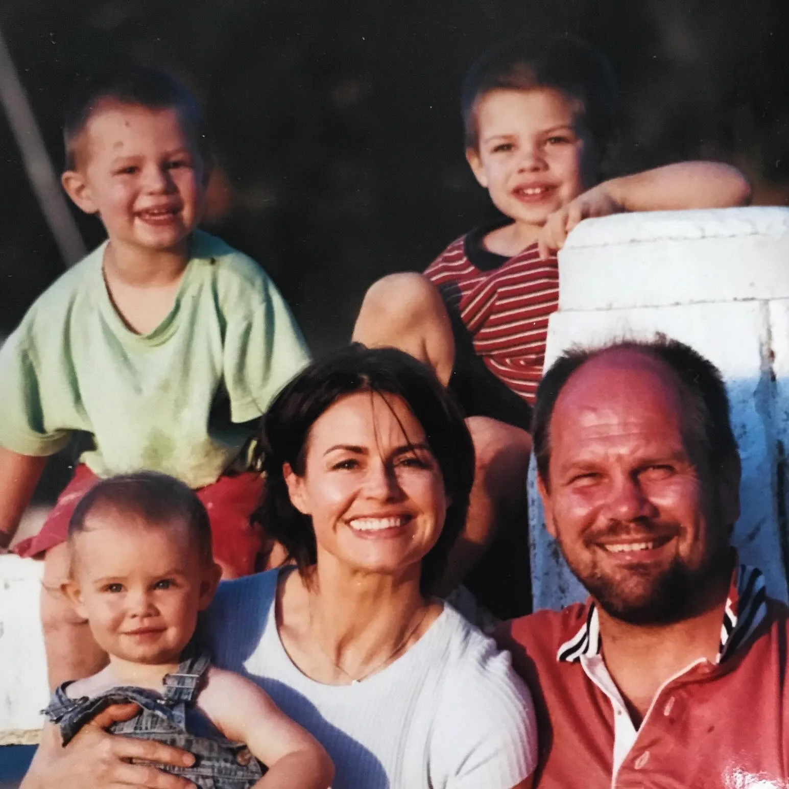 Lisa Wilkinson and Peter FitzSimons with their kids when they were young