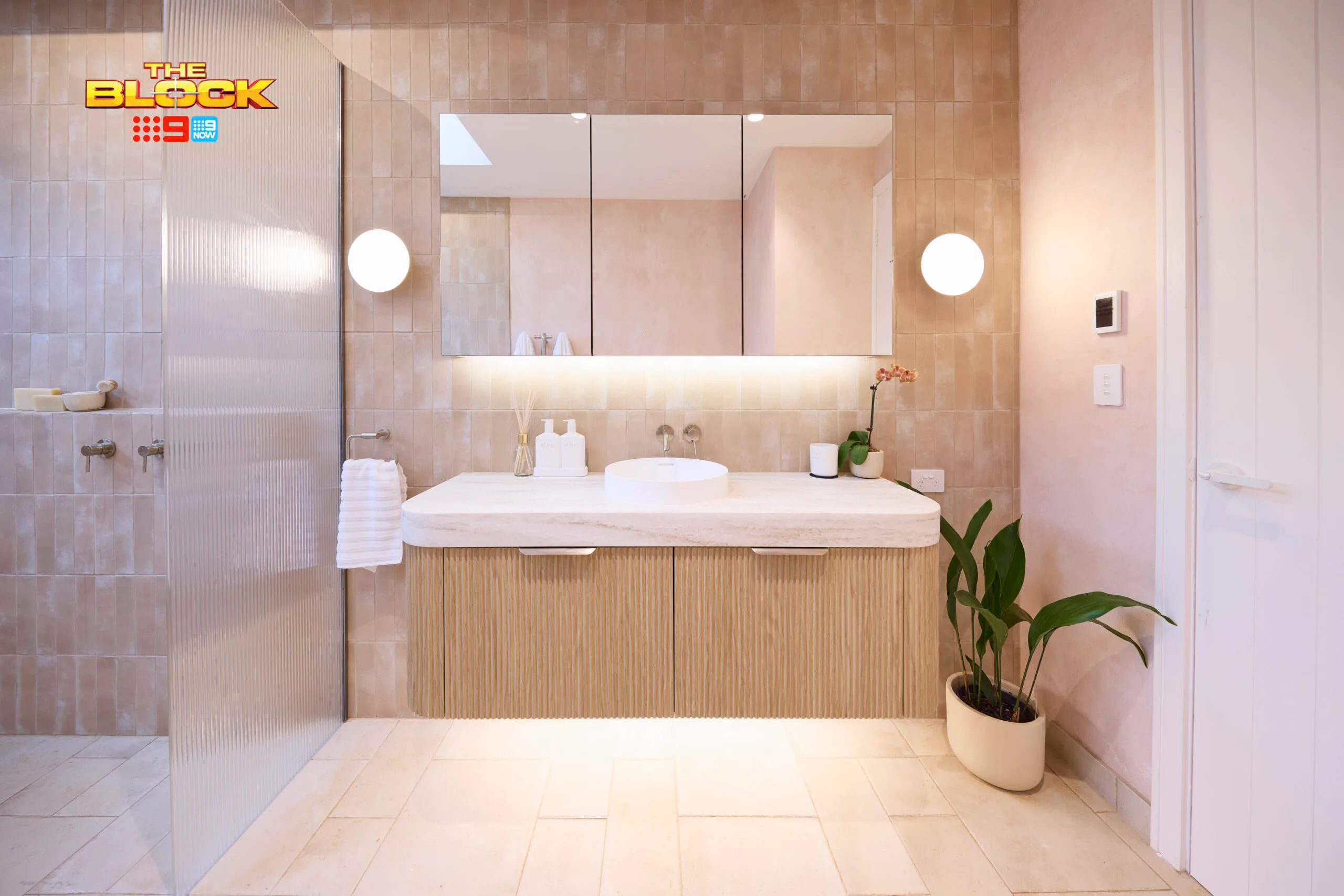 Britt and Taz's bathroom from the block with a timber fluted vanity. 