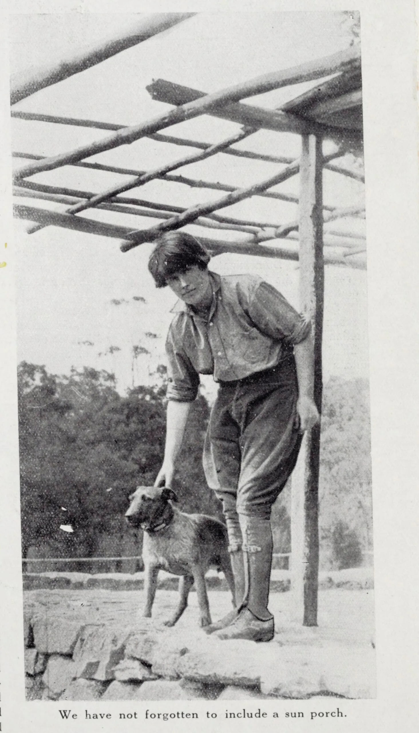 A page from an issue of Australian Home Beautiful. A black and white photo depicts garden designer Edna Walling with her dog, alongside the caption "We have not forgotten to include a sun porch".