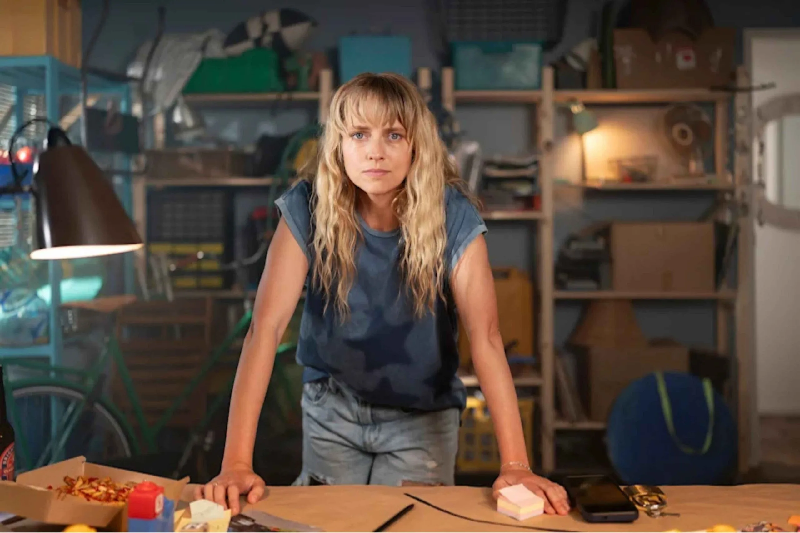 Teresa Palmer in a messy garage in the ABC TV series The Family Next Door.