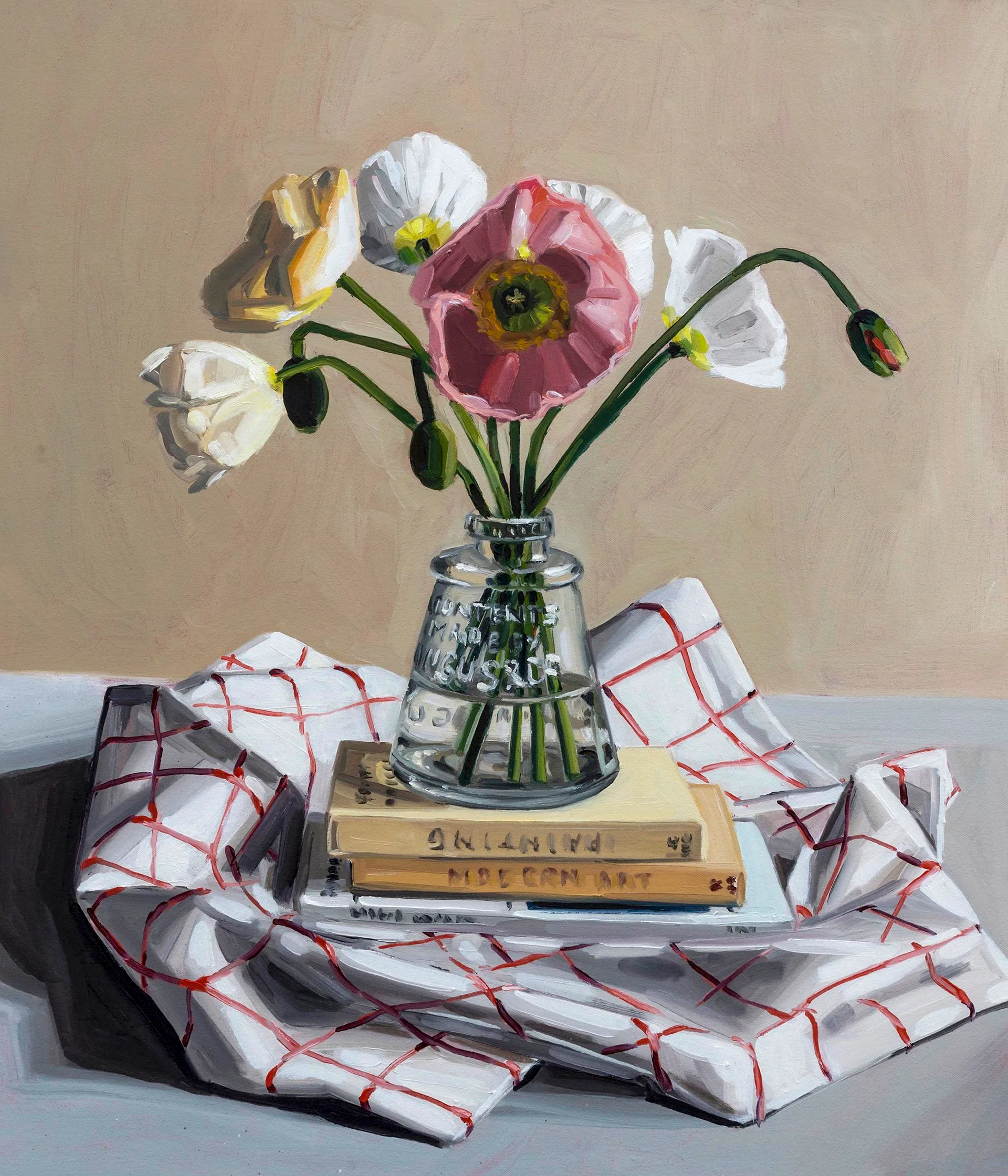 A still life painting of books, tablecloth and glass vase filled with flowers.