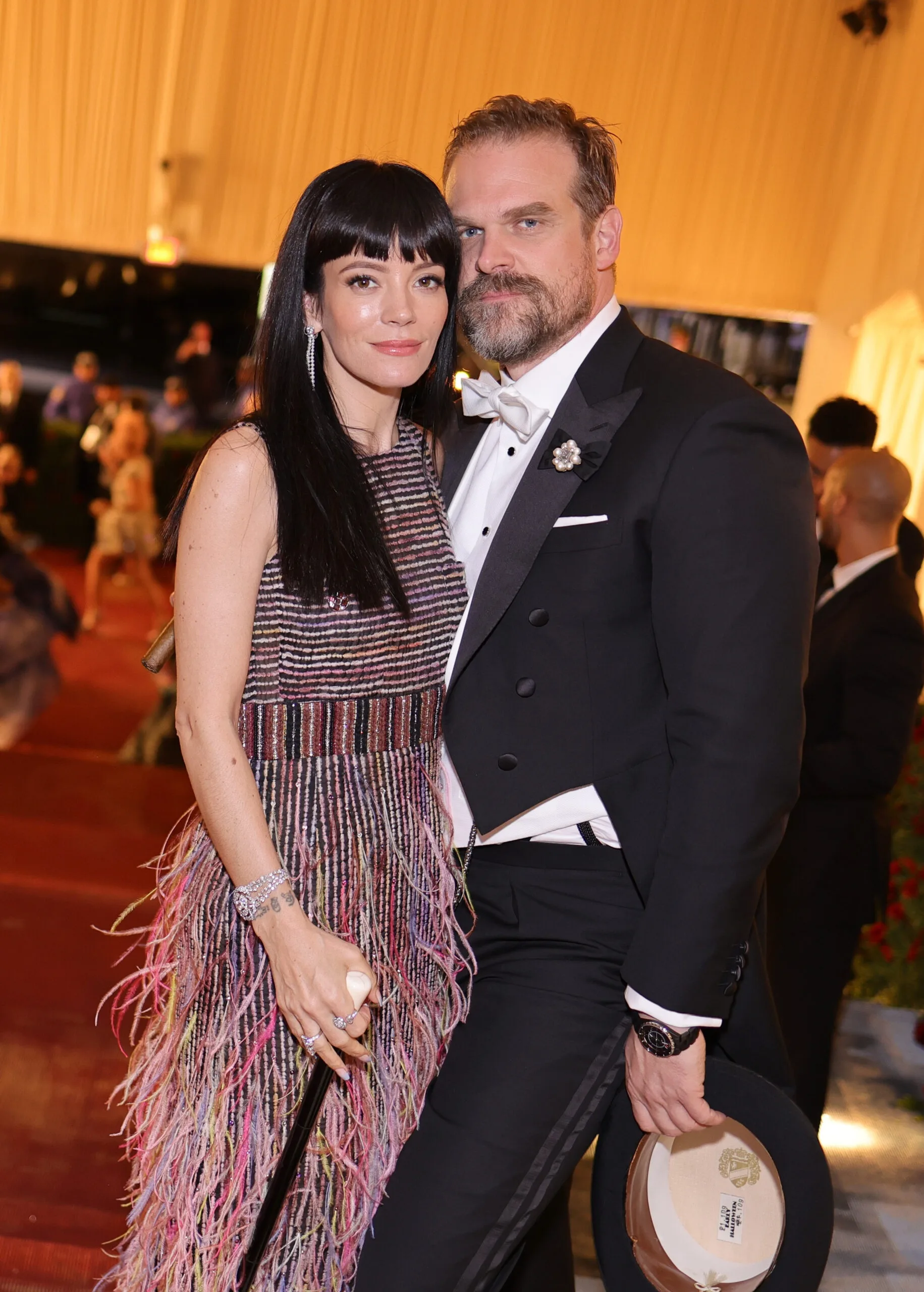 Lily Allen and David Harbour in formal attire.