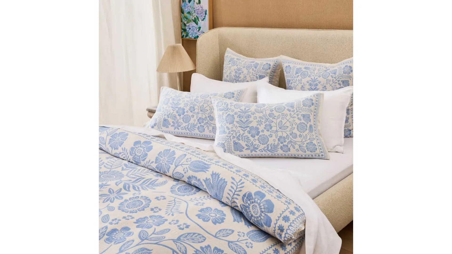 Bed set that's cream toned with blue floral pattern