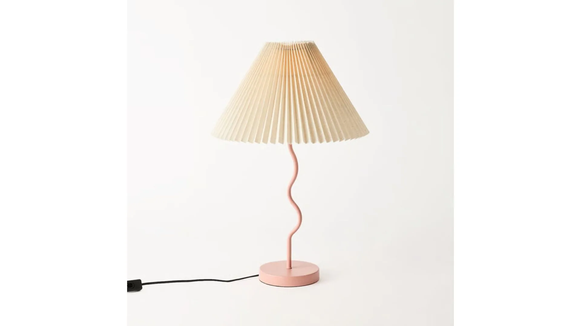 Table lamp with curved base and pleated lampshade