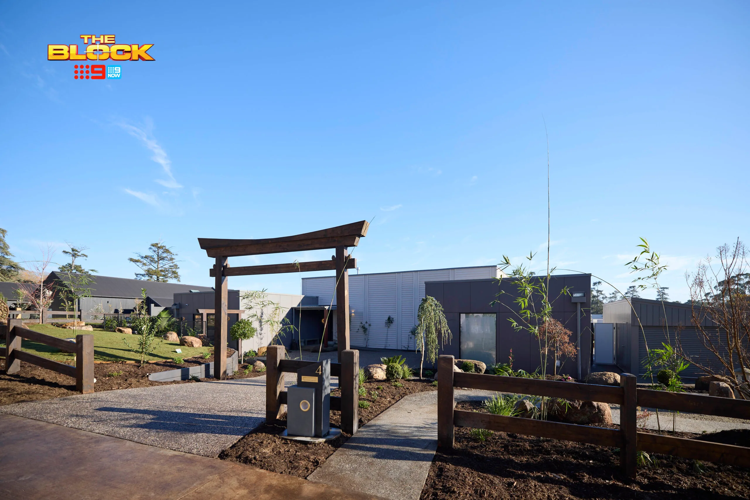 Han and Can's front yard with a Japanese Arbor on the Block.