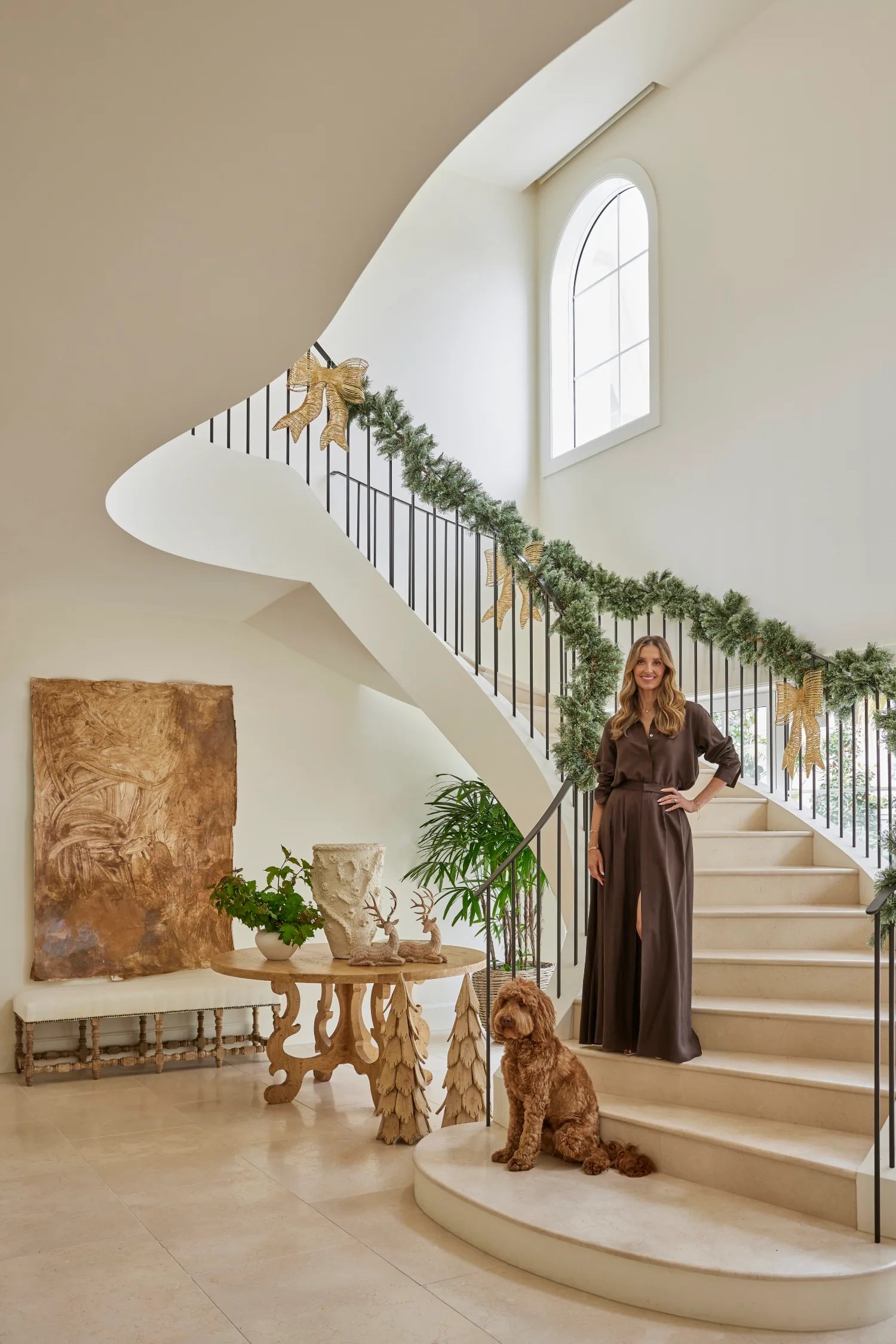 Kate Waterhouse on staircase with her dog