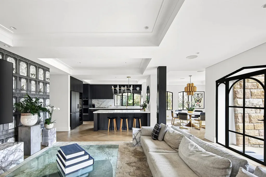 Black and white family room and kitchen in a Walter Burley Griffin house in Pymble.