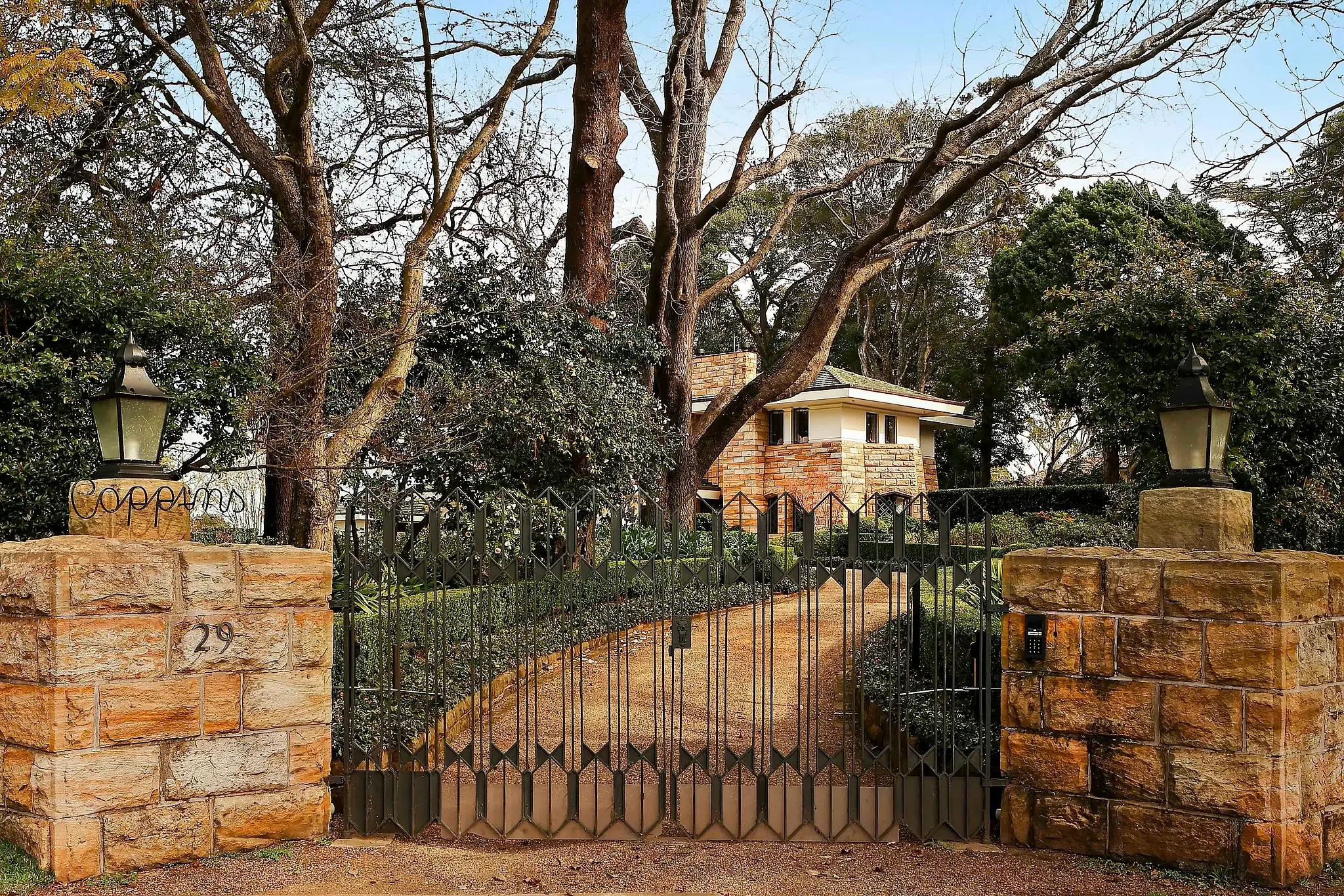 Front gates and sandstone gateposts outside a Walter Burley Griffin house in Pymble.