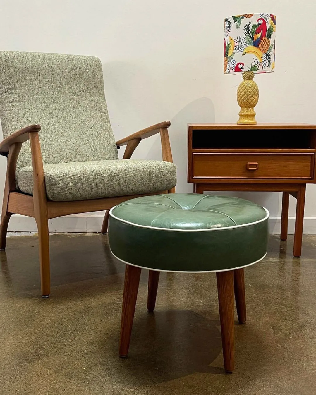 a vintage green chair, ottoman and side table at retro rehab second hand furniture store in melbourne